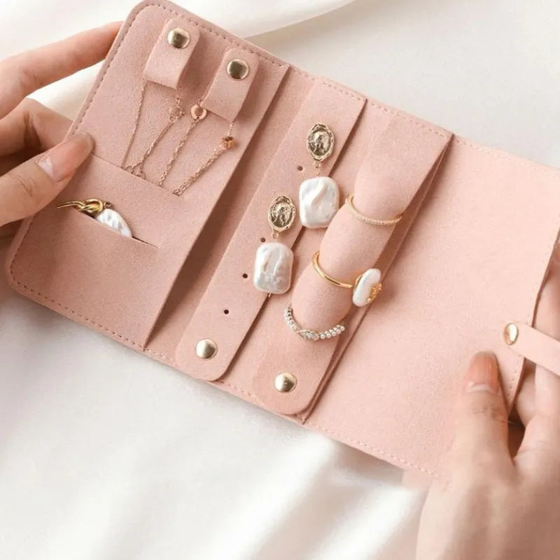 Soft brown leather and microfiber jewellery storage bag showing compact 12cm size.