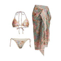 Women's creamy white floral bikini set with top, briefs, and matching skirt on a mannequin.