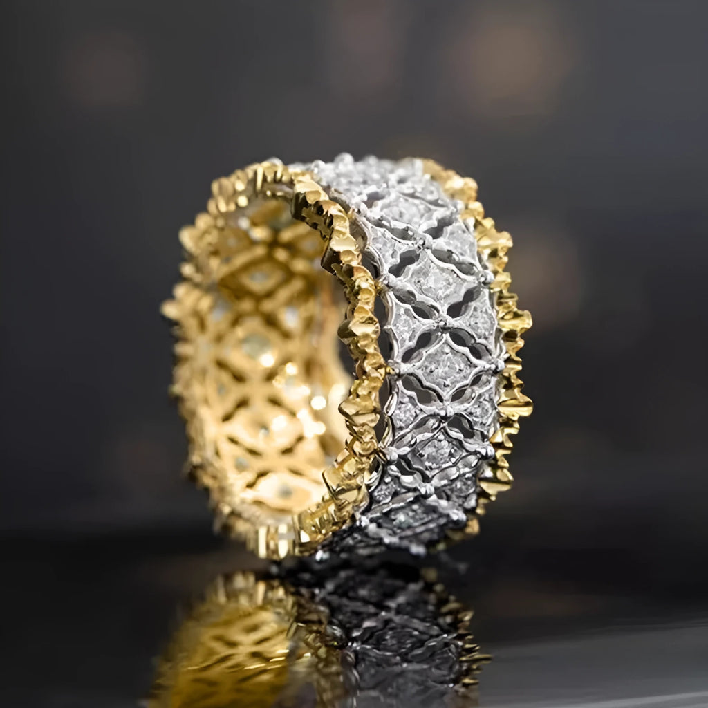 Geometric zircon ring with two-tone gold and silver electroplated finish on a copper band.