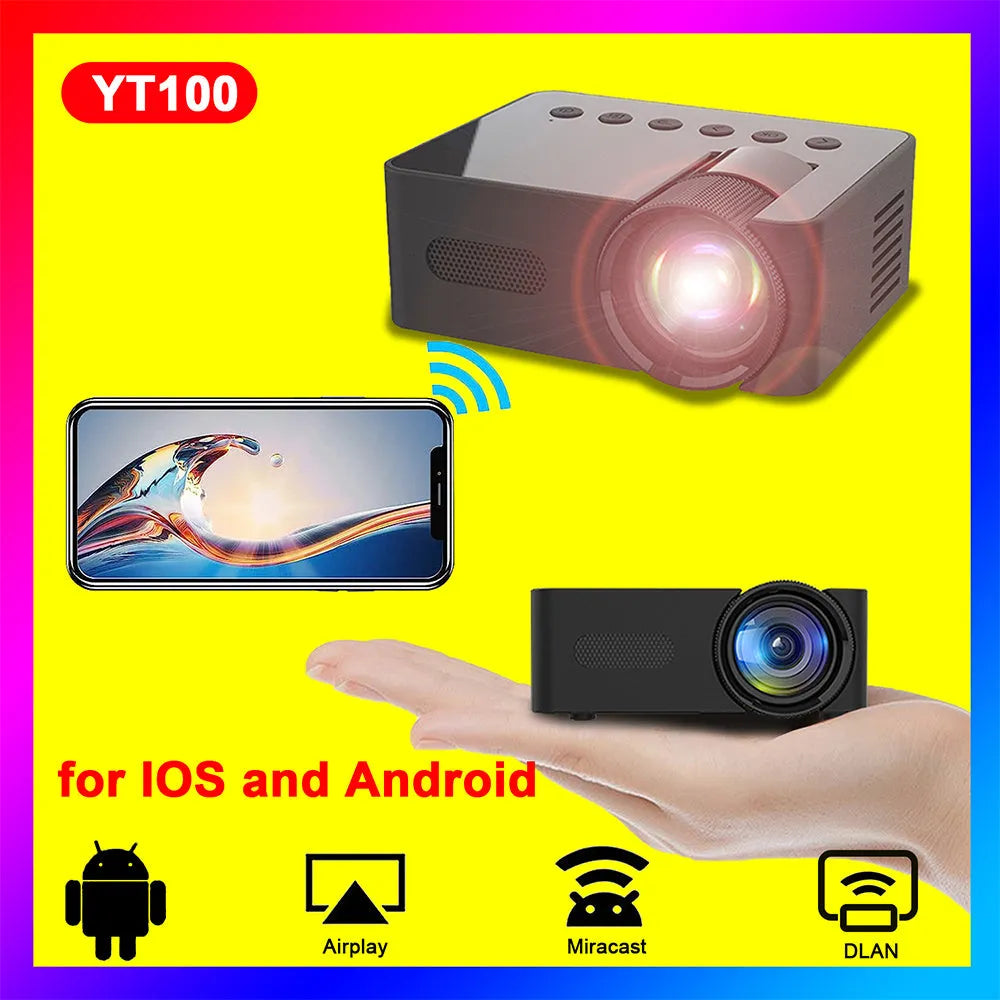 YT100 black mini portable projector on a desk with remote control and USB cable