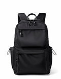 Blue Oxford cloth student backpack with anti-theft design and USB charging port, side view