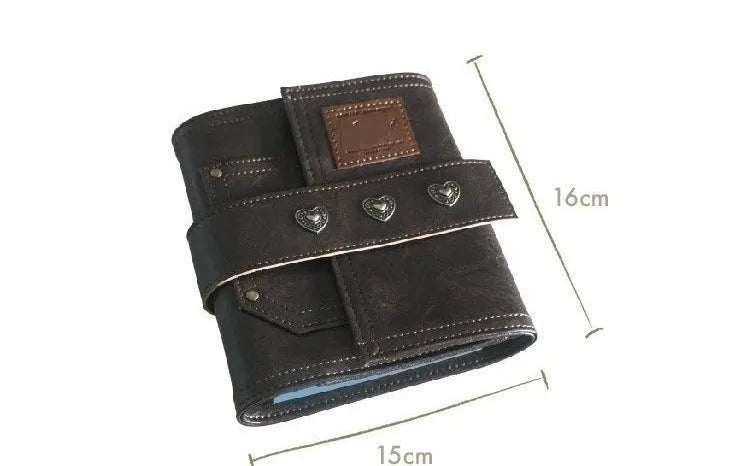 Brown A7 size notebook with a retro PU cover and leather buckle, showing loose-leaf binding.