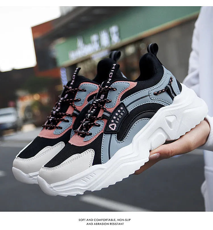 Women's white mesh casual trainers with a thick sole, round toe, and a buckle fastening detail.