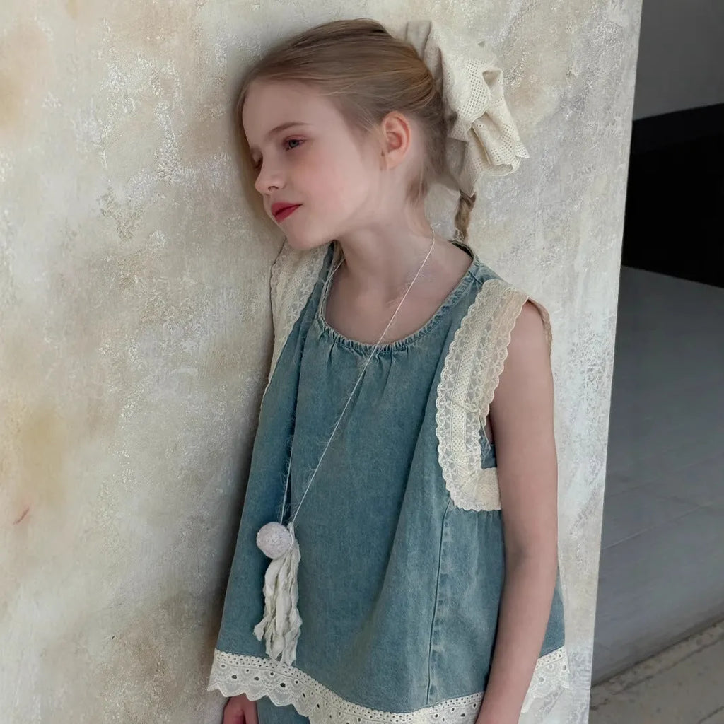 Light blue girls' lace trim denim cropped wide-leg pants and sleeveless vest two-piece set on model