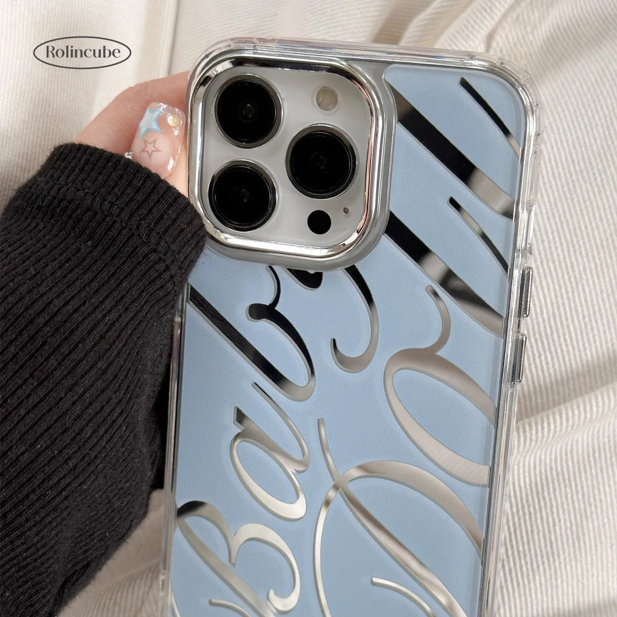 Clear TPU iPhone case with mirrored finish showing JMKJ letters on blue background for models 11 to 16