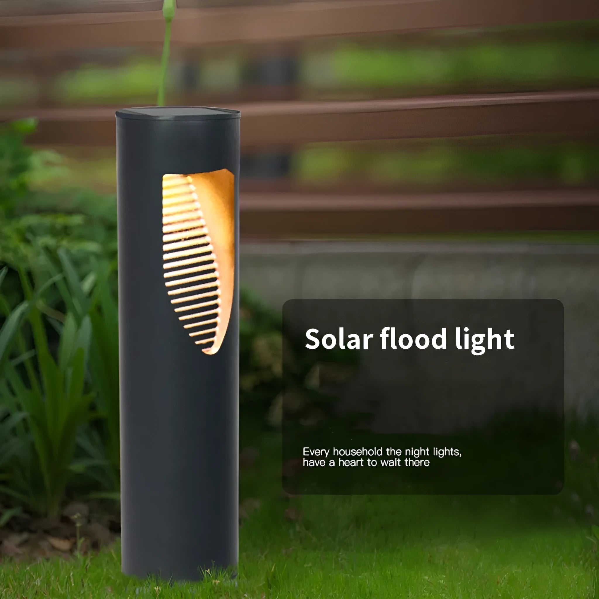 Black geometric abstract art solar-powered stainless steel garden lantern on grass.