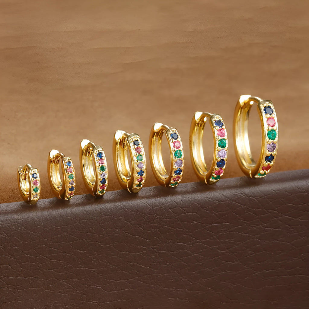 Circle zircon perforated stud earrings in gold, rose gold, and silver colours with geometric design
