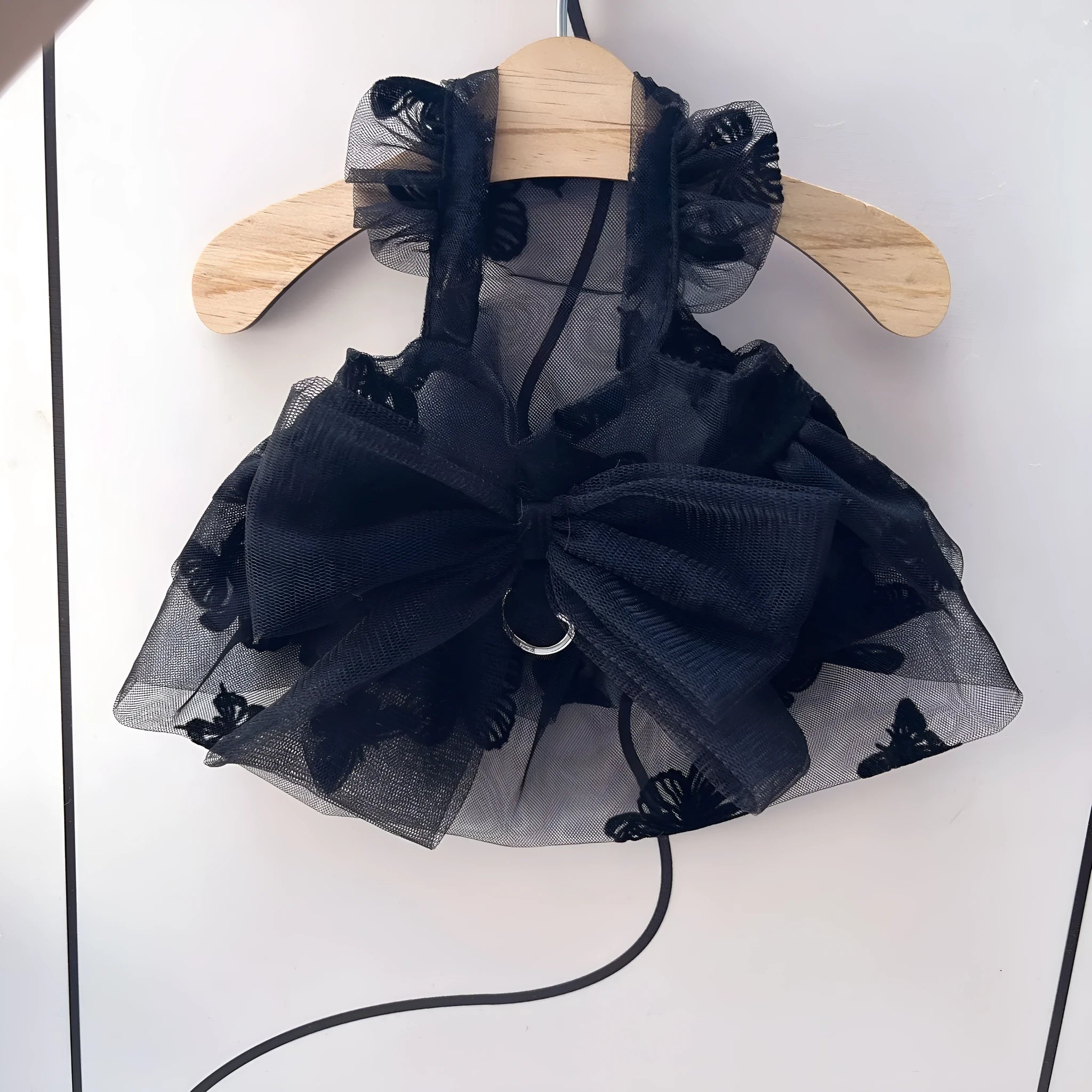 Black gauze tulle skirt pet costume for small to medium dogs and cats on a mannequin.