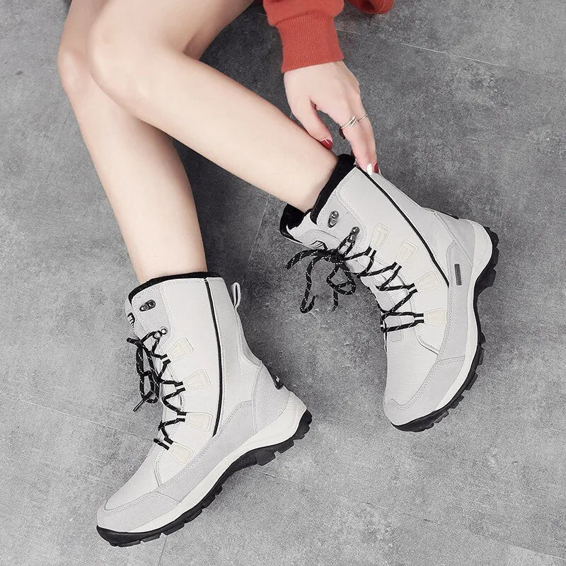 Women's mid-calf length thermal snow boots in genuine leather with round toe design