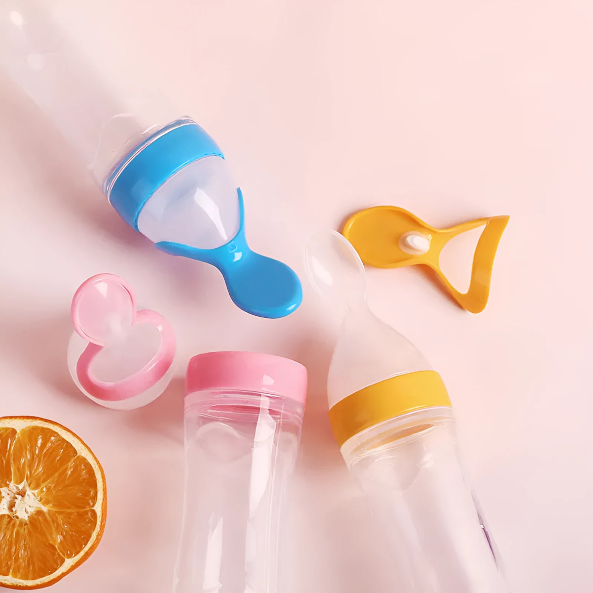 Silicone baby rice paste feeding bottle with suction cup base in blue, green, pink, white, or yellow.