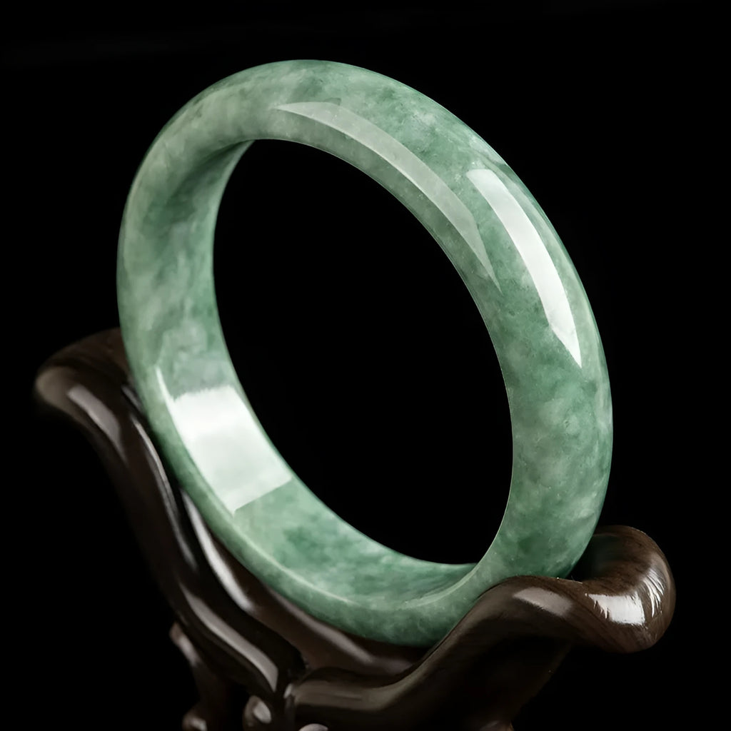Natural emerald bean green simple solid bracelet on a gift box, showing dark pea green colour.