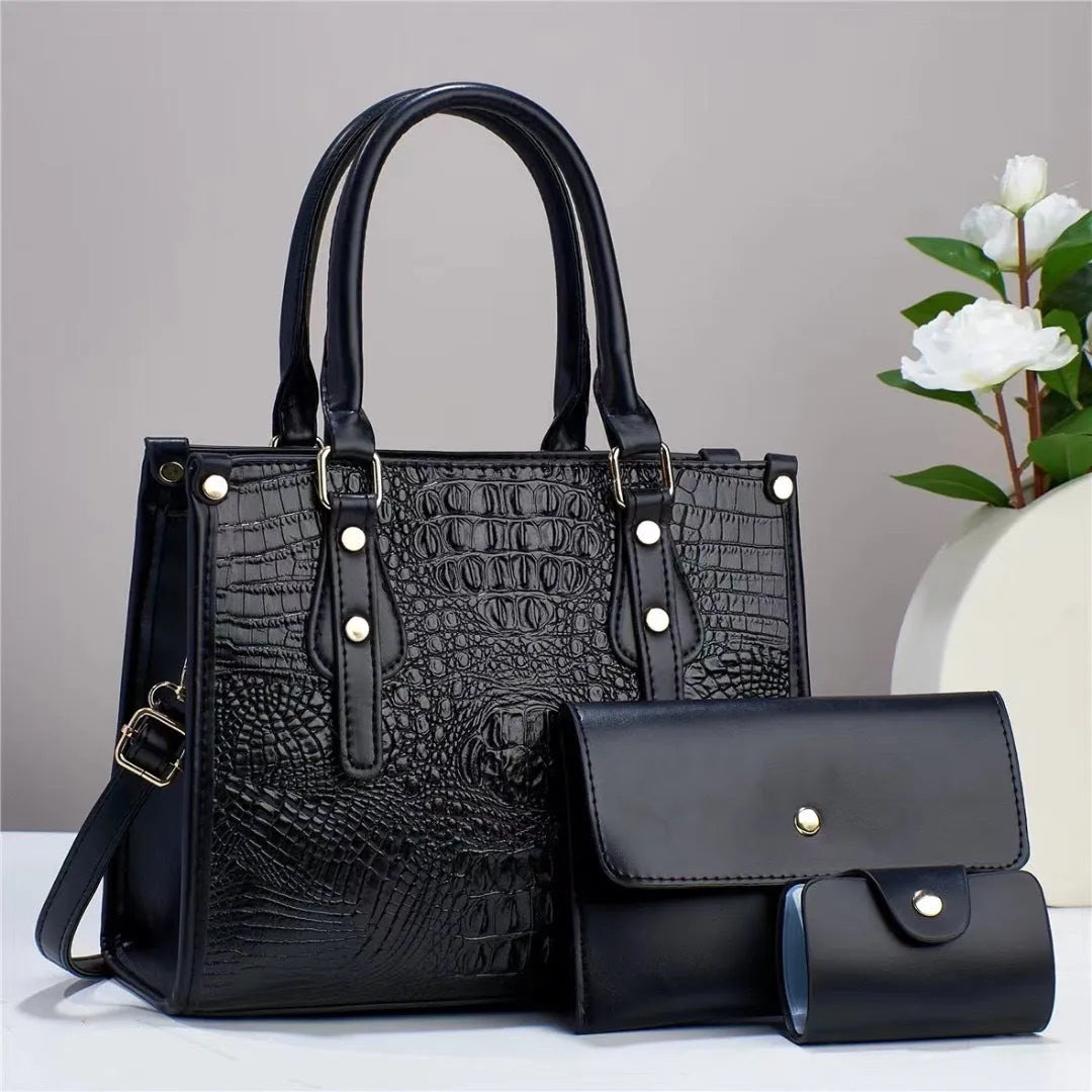 Three-piece PU leather handbag set showing crossbody bag, wallet and card bag in burgundy colour