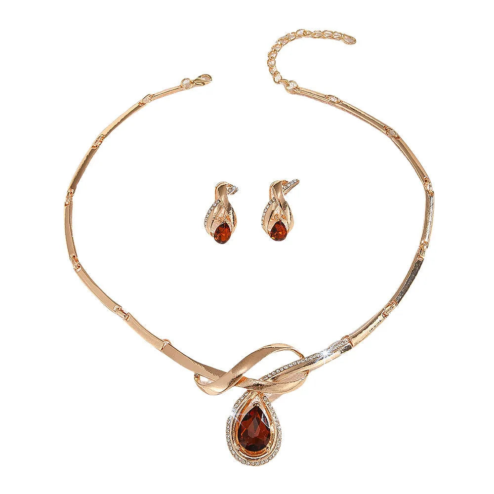 Gold alloy necklace and earrings set with white rhinestone and brown crystal inlay, V-shaped pendant, fishtail fan design