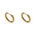 A pair of geometric circle ear clips for women in gold or silver finish.
