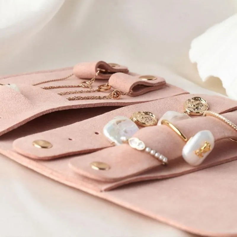 Soft brown leather and microfiber jewellery storage bag showing compact 12cm size.
