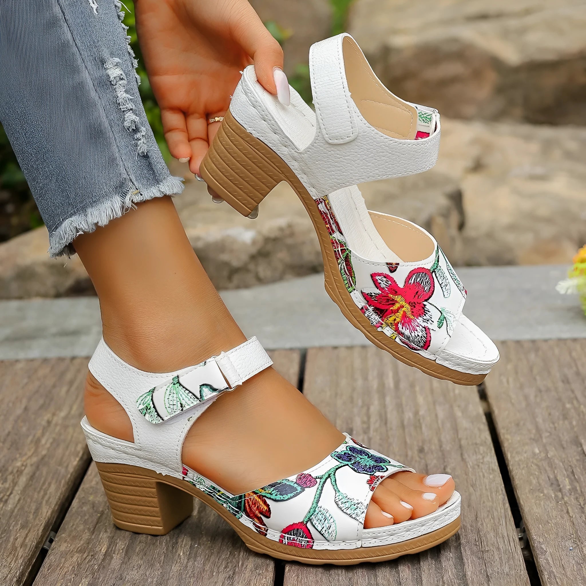White women's high heel sandals with velcro buckle closure showing PU leather upper and rubber sole