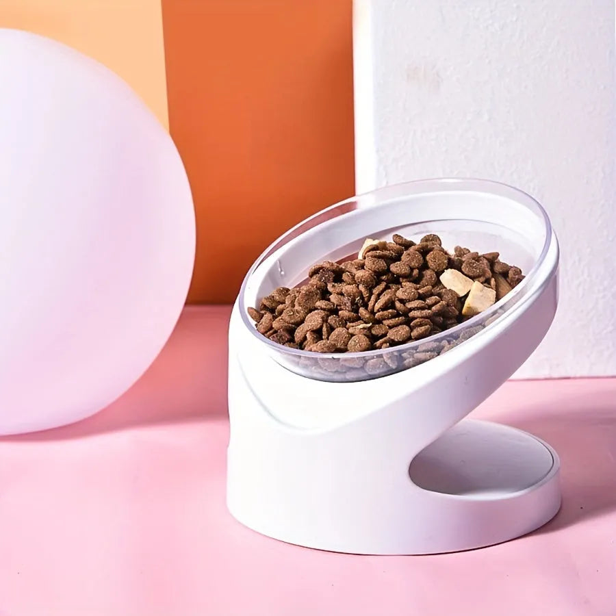 Clear plastic elevated cat food bowl with a tilted feeding platform.