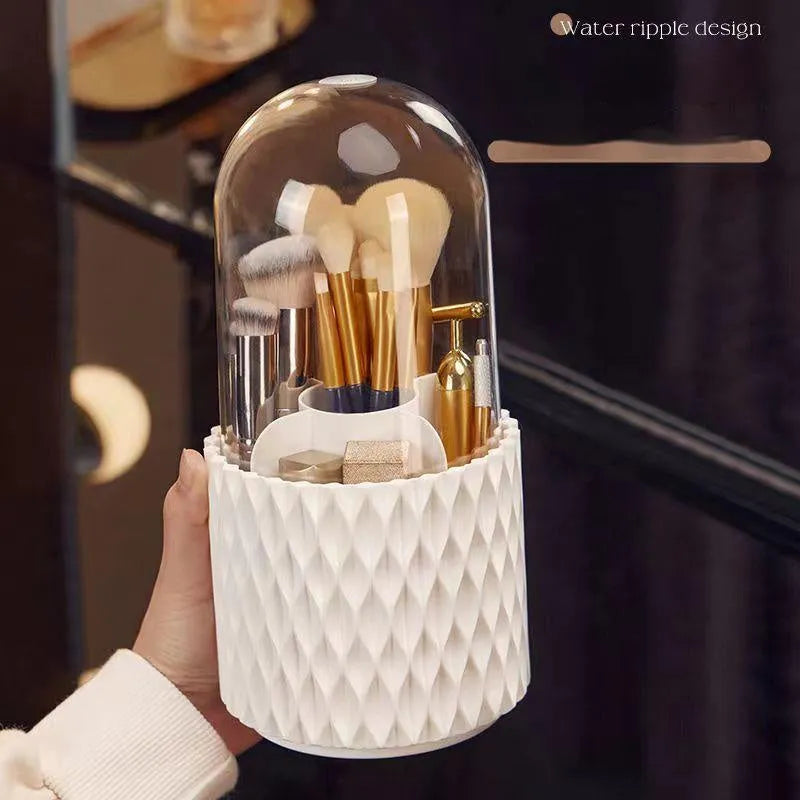 White rotating makeup brush storage box with transparent dust-proof cover on desktop
