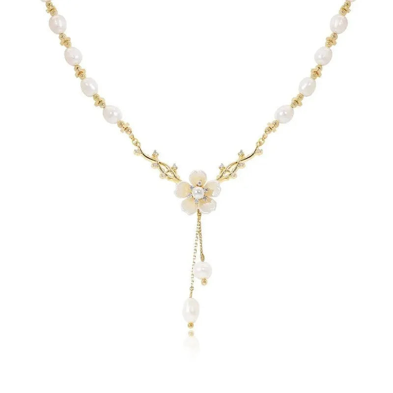 Women's alloy necklace with pearl flower design and rose accents on pearl chain