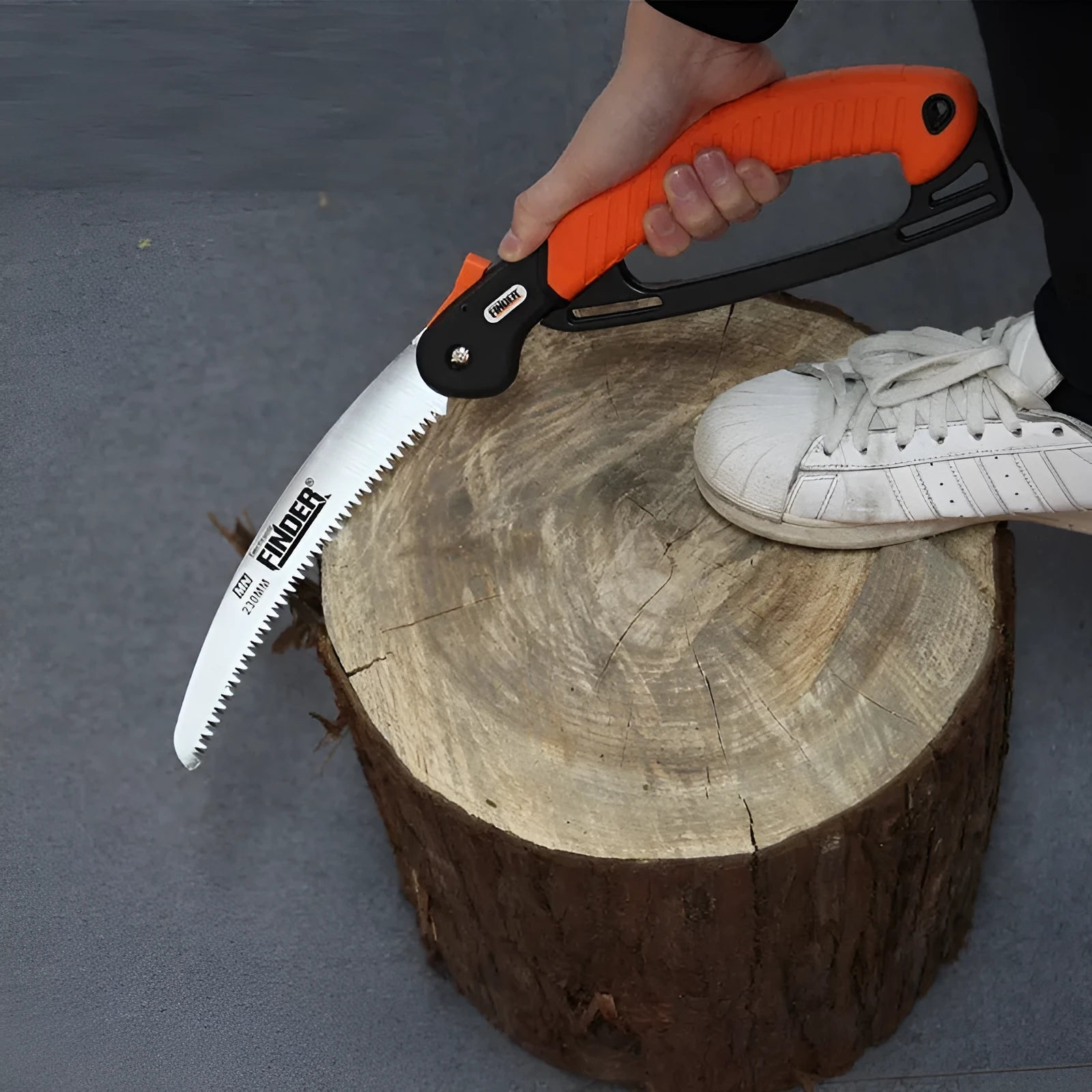 230mm folding pruning saw with TPR handle extended for cutting, showing 65MN steel blade with 32 teeth