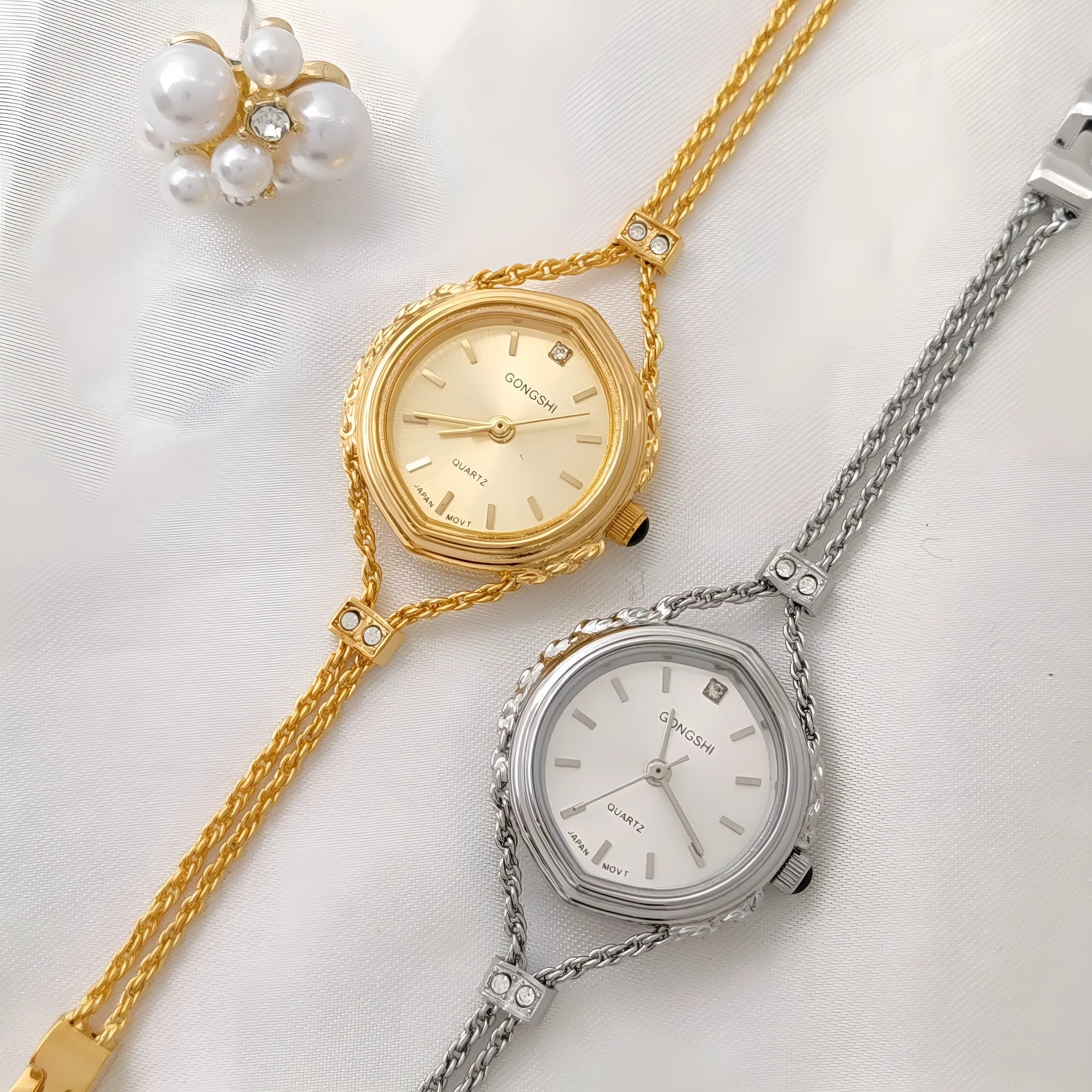 Gold or silver Mori-style women's quartz watch with a 25mm dial and metal chain strap.