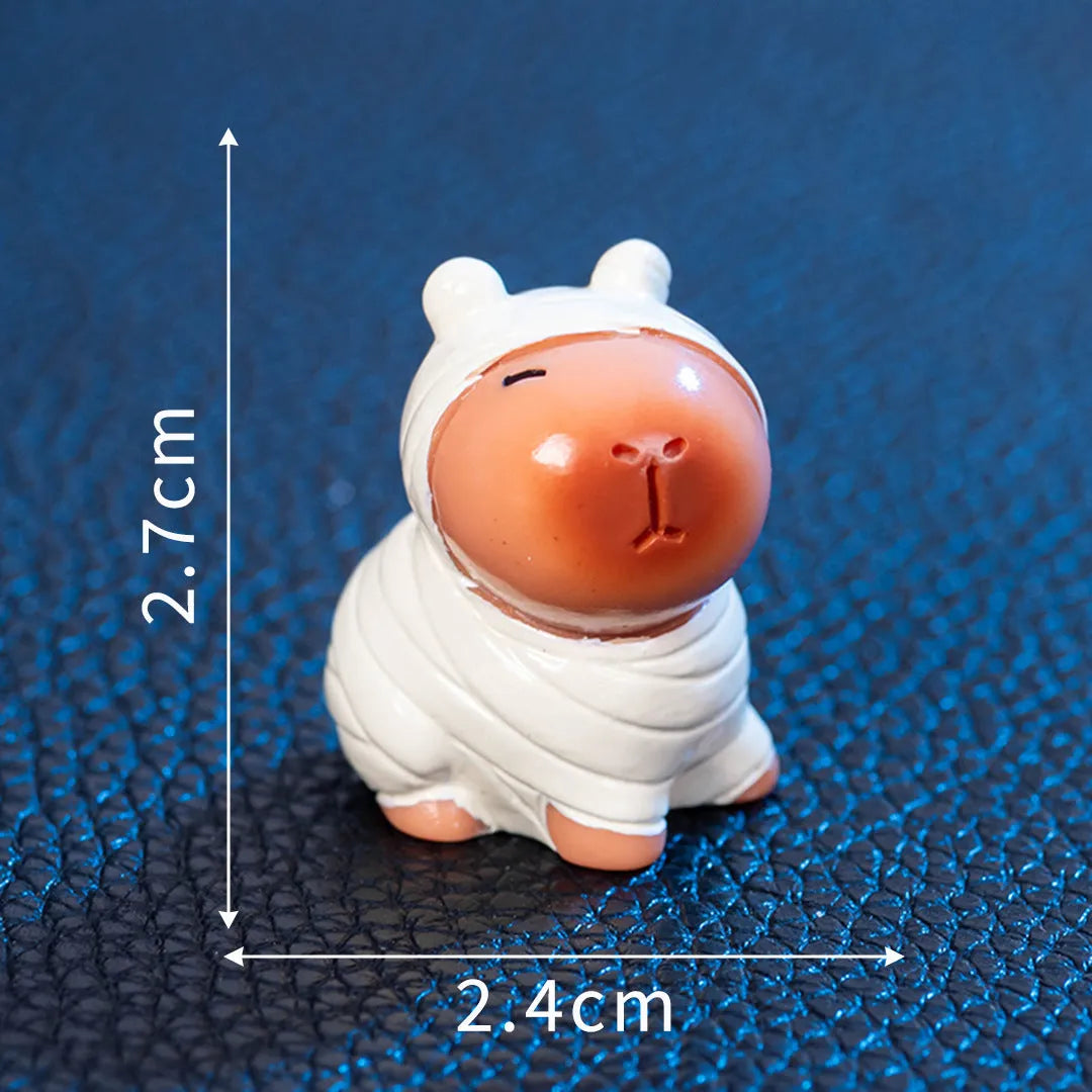 Eight different Halloween-themed capybara resin figurines displayed together