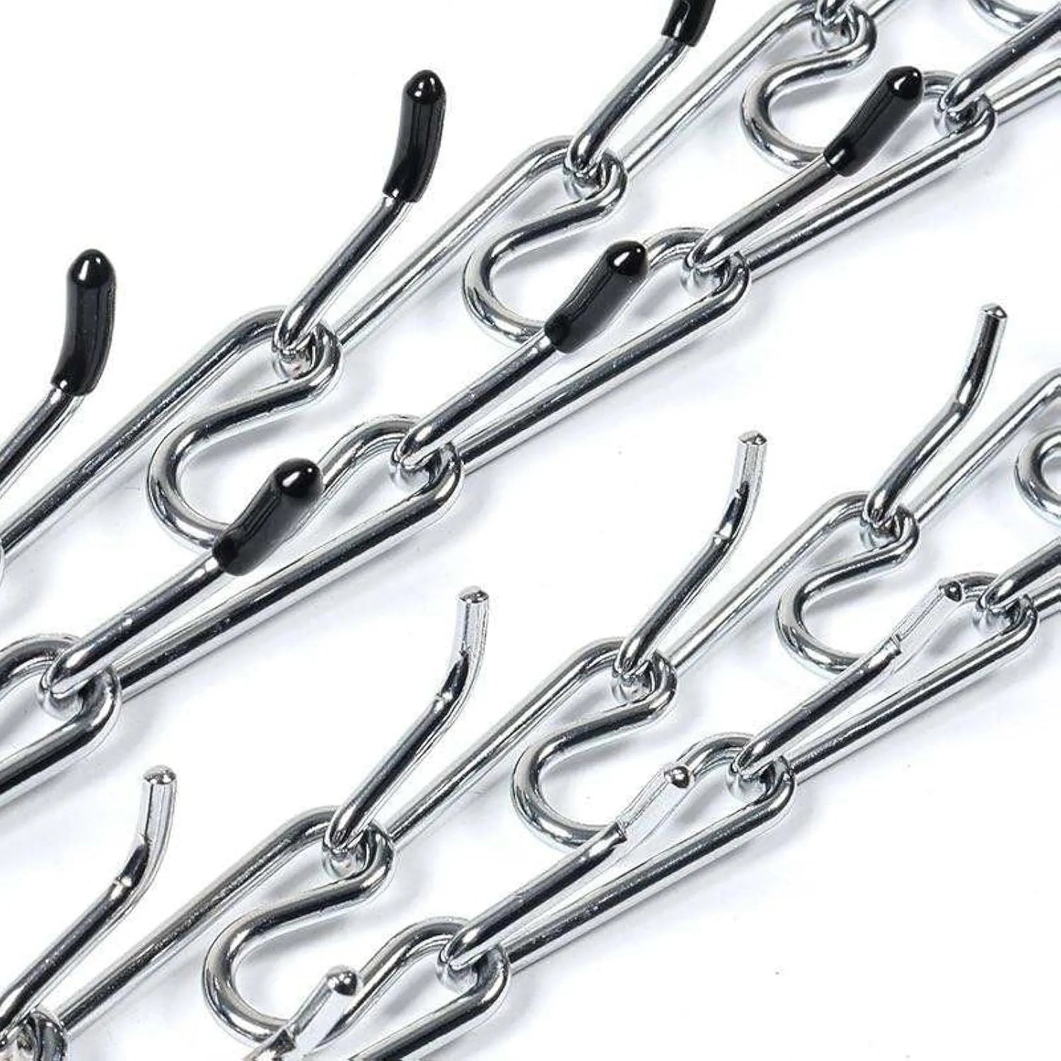 Stainless steel dog prong collar with rubber tips and adjustable chains on a grey background.