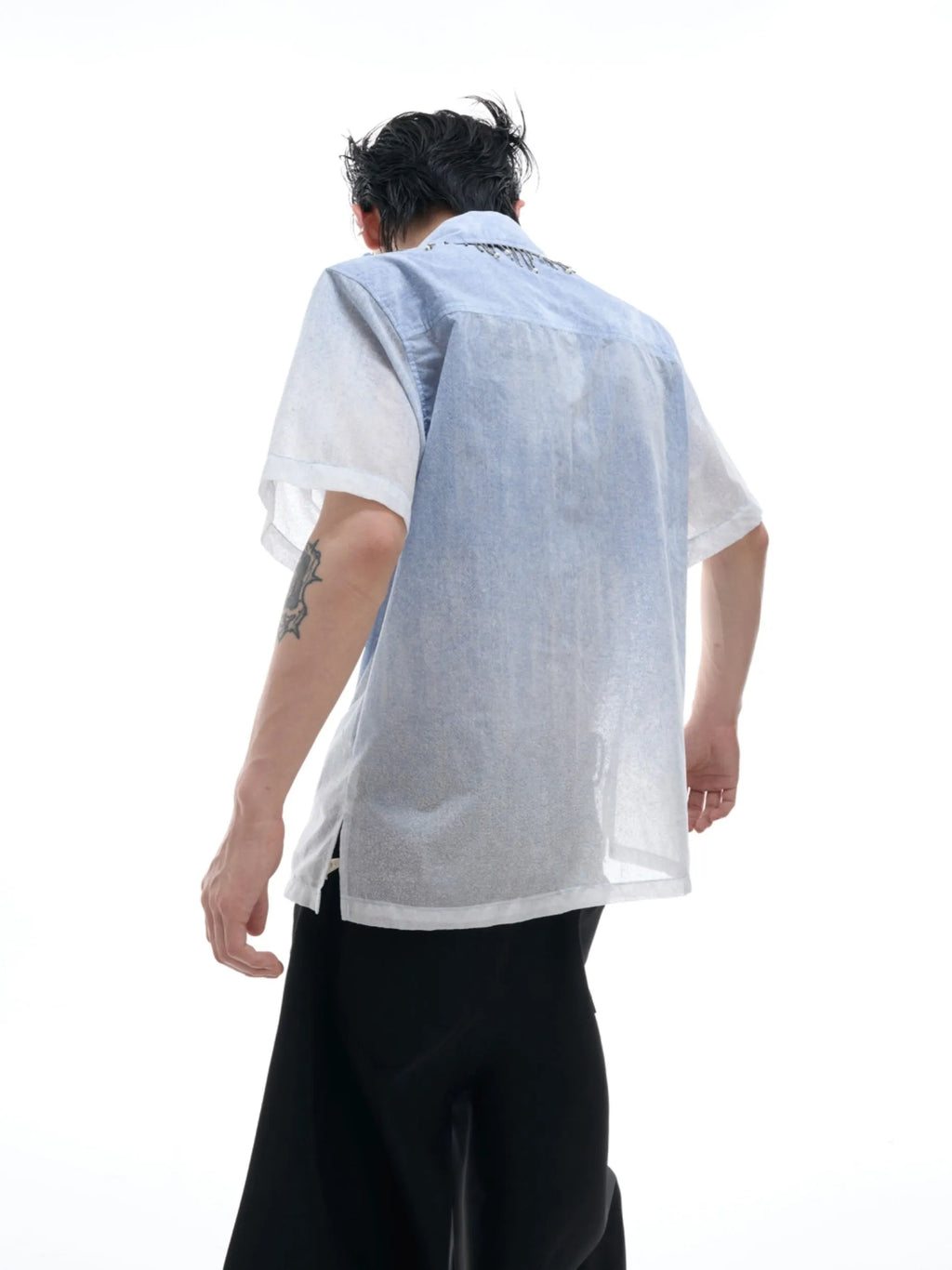 Blue to white gradient loose-fit short sleeve polyester shirt on a hanger.
