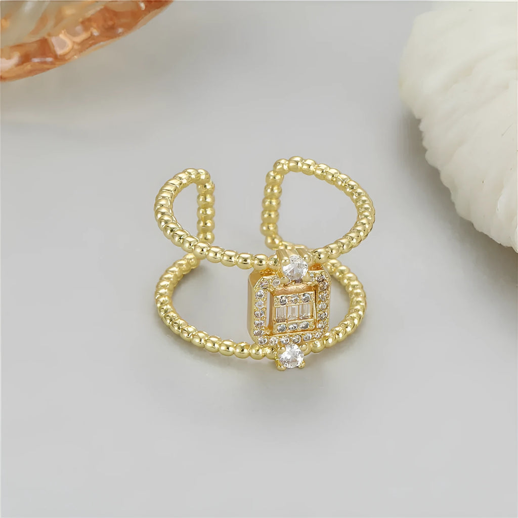 Adjustable open ring with asymmetric U-shape design in 14K gold-plated copper, colour H-12813.