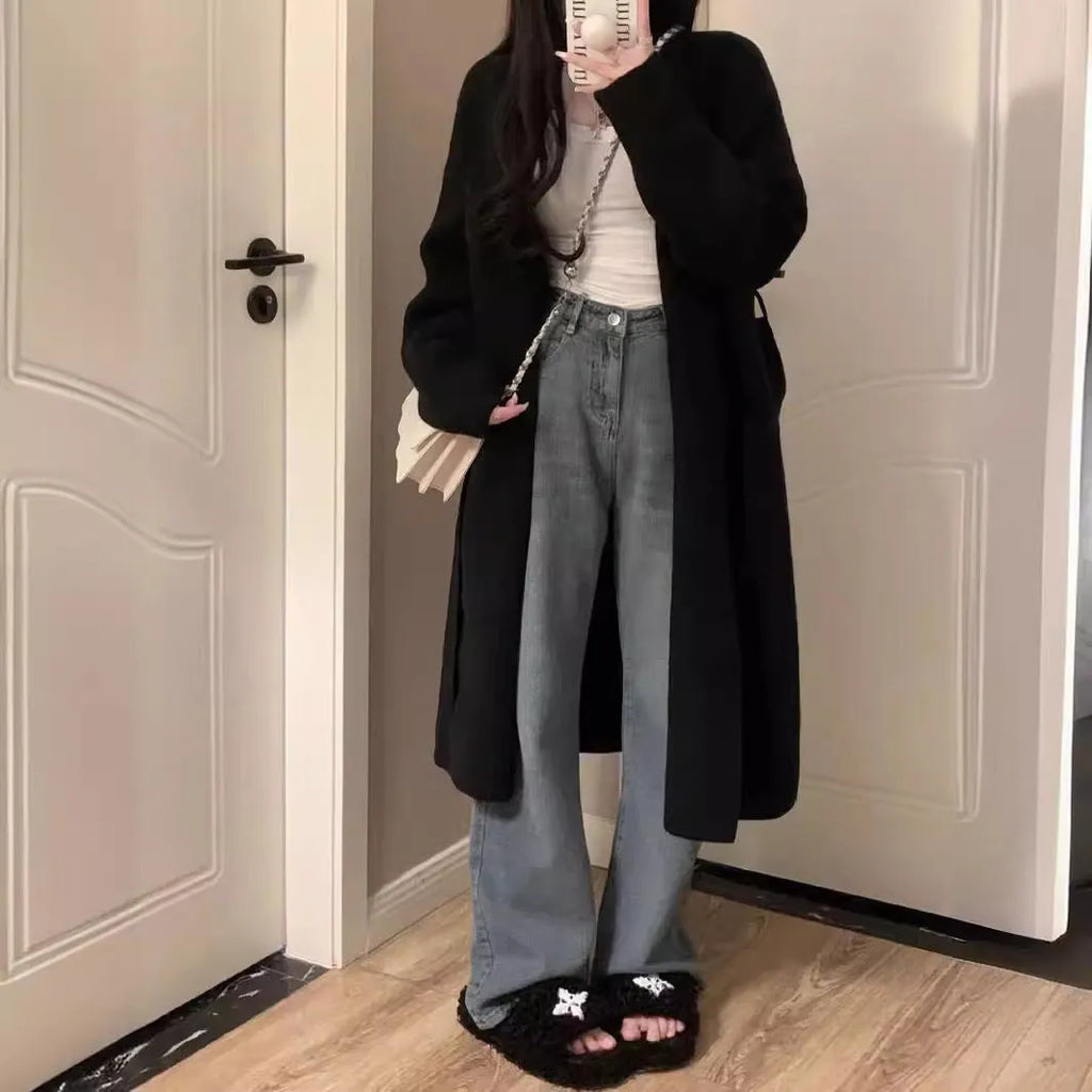 Women's loose fit grey knitted cardigan with V-neck and long sleeves, mid-length style.
