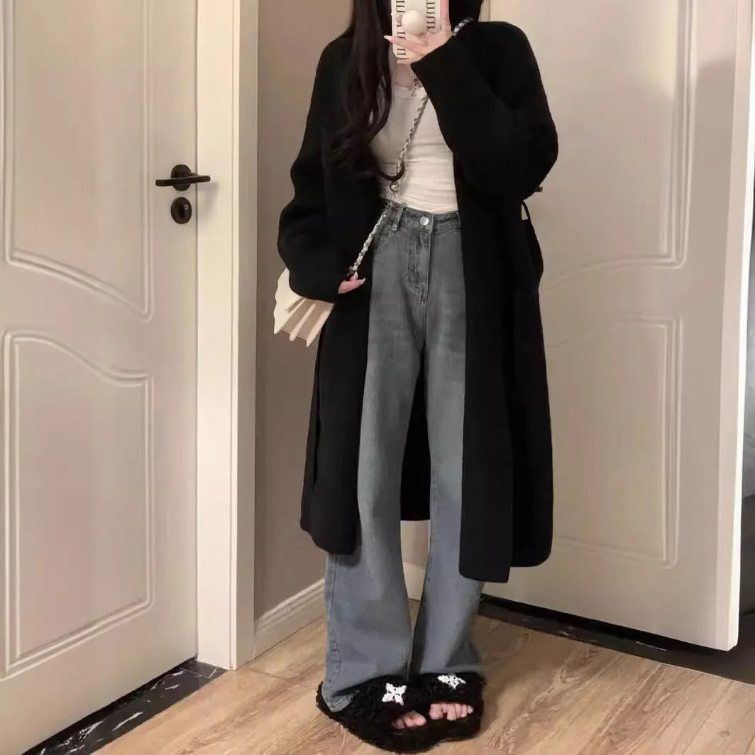 Women's loose fit grey knitted cardigan with V-neck and long sleeves, mid-length style.