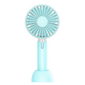 Blue handheld mini USB electric fan with oscillation feature on a desk.