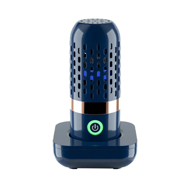 Blue capsule fruit and vegetable purifier with USB charger on a kitchen countertop