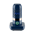 Blue capsule fruit and vegetable purifier with USB charger on a kitchen countertop