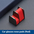 Zinc alloy and leather car dashboard clip for holding sunglasses, shown in green.
