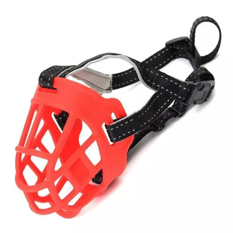 Soft silicone dog muzzle in black with cotton webbing strap on a table, anti-bite and anti-eating design