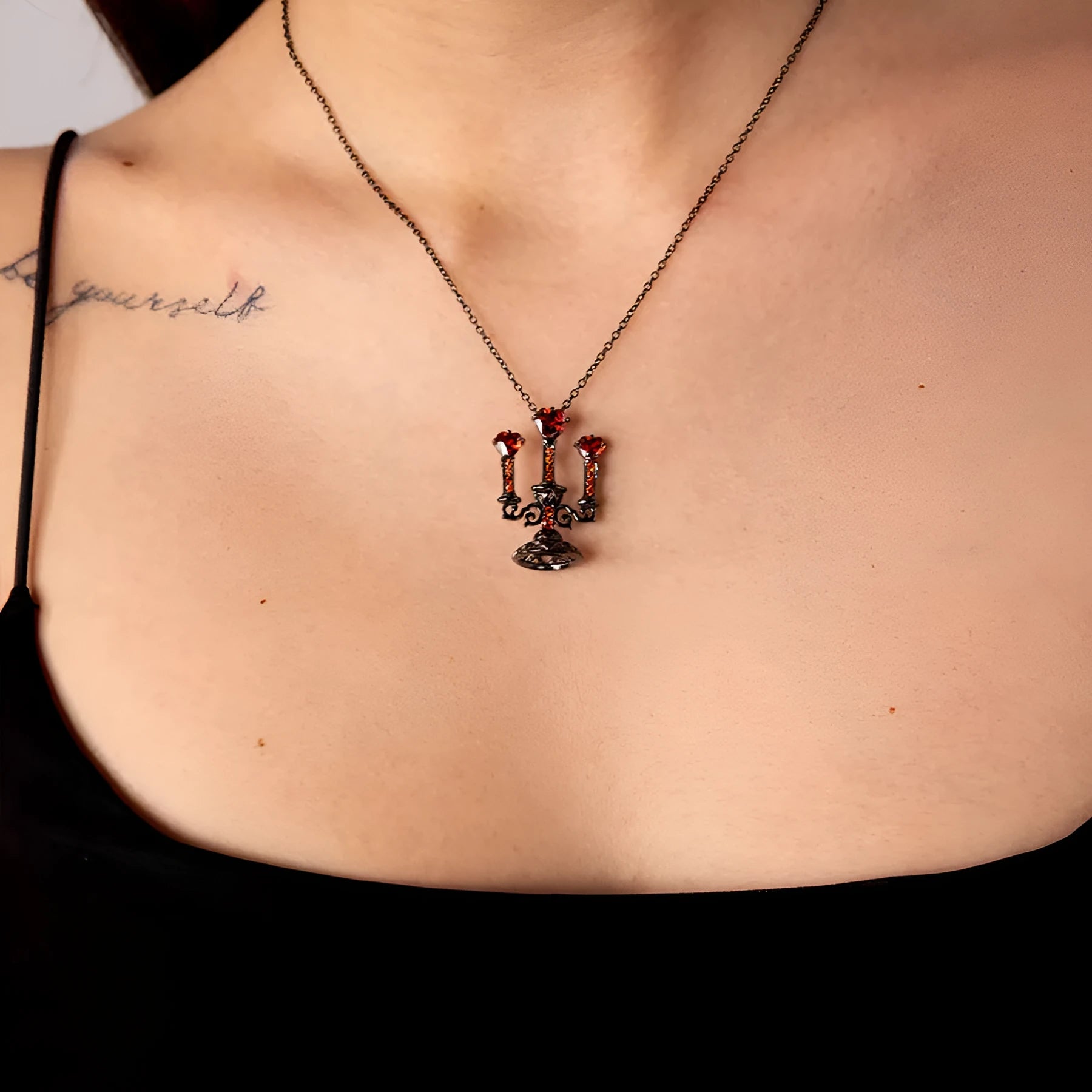 Gothic women's necklace with hollow candlestick pendant on a cross chain in retro finish.
