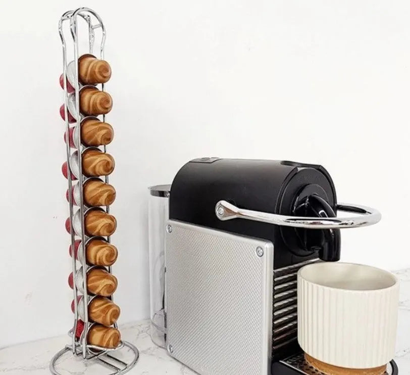 Black wrought iron coffee capsule storage rack holding 20 pods on display shelves.