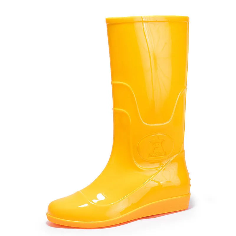 Flat washable plastic rain boots in white with high tube design and round toe