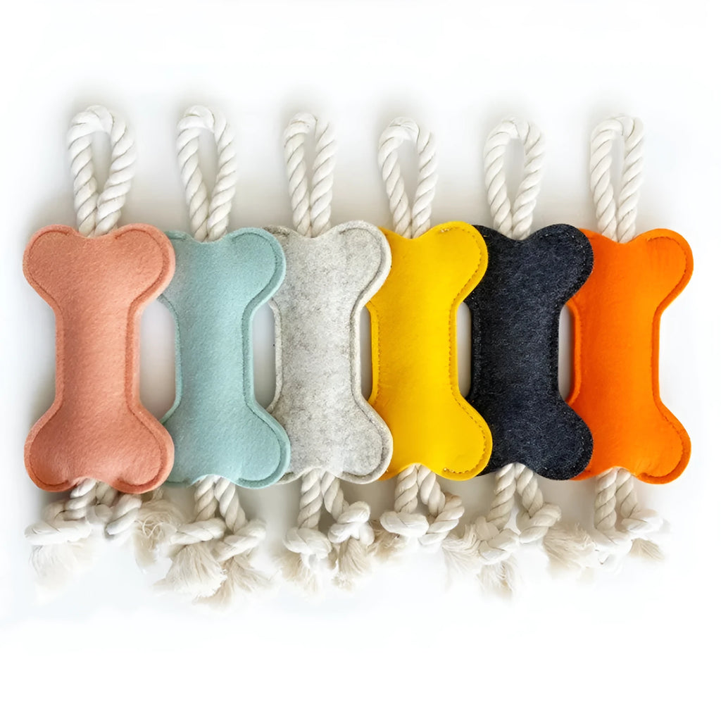 Bone-shaped felt dog chew toy in colour option for dental grinding