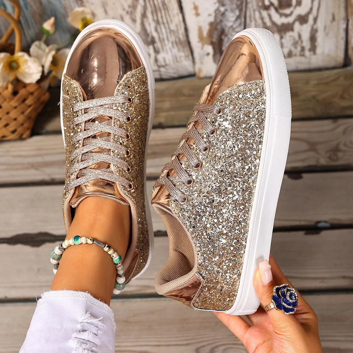 Women's plus size sequined board shoes in black with front lace-up fastening and flat rubber sole.