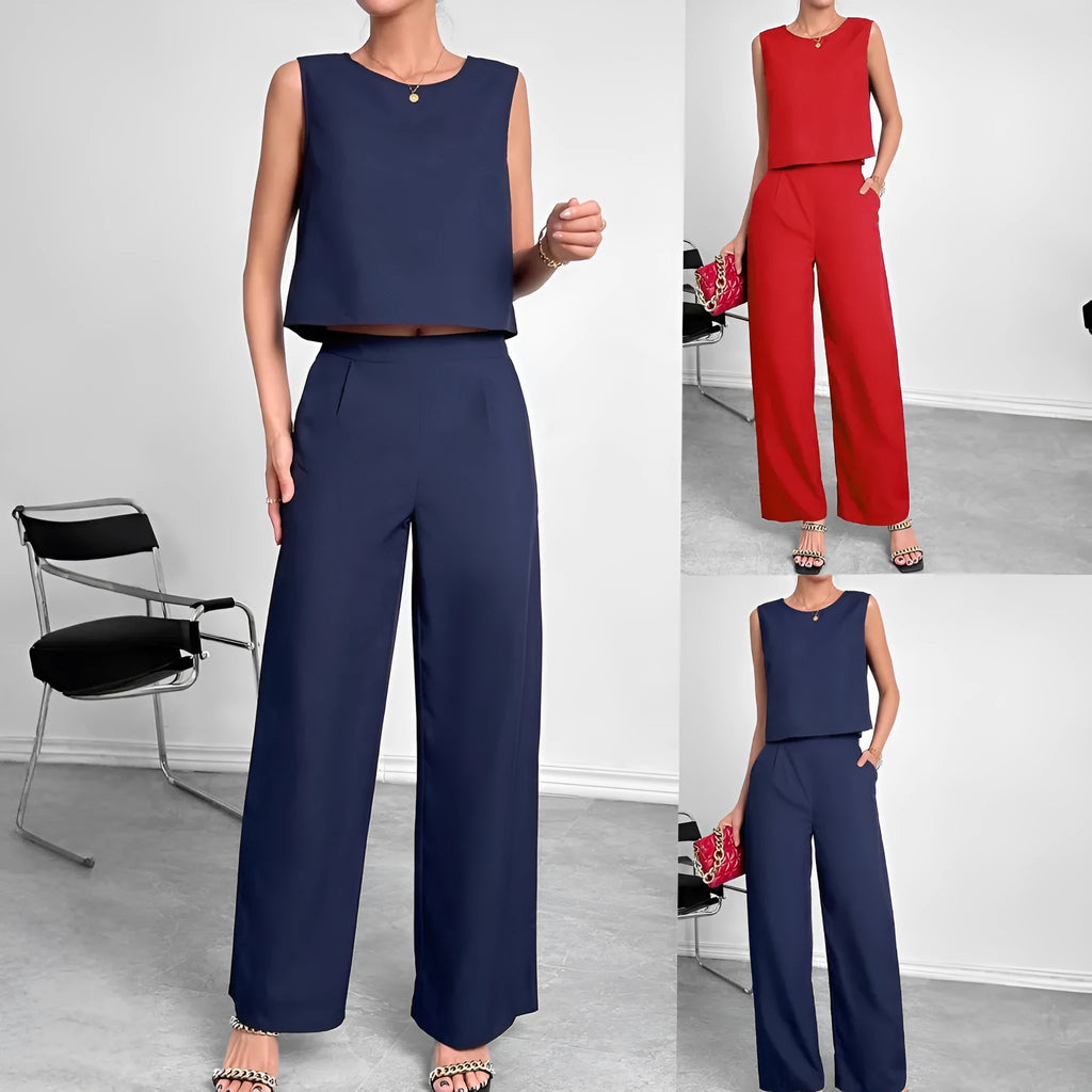 Red polyester women's two-piece set with sleeveless top and wide-leg trousers laid flat.