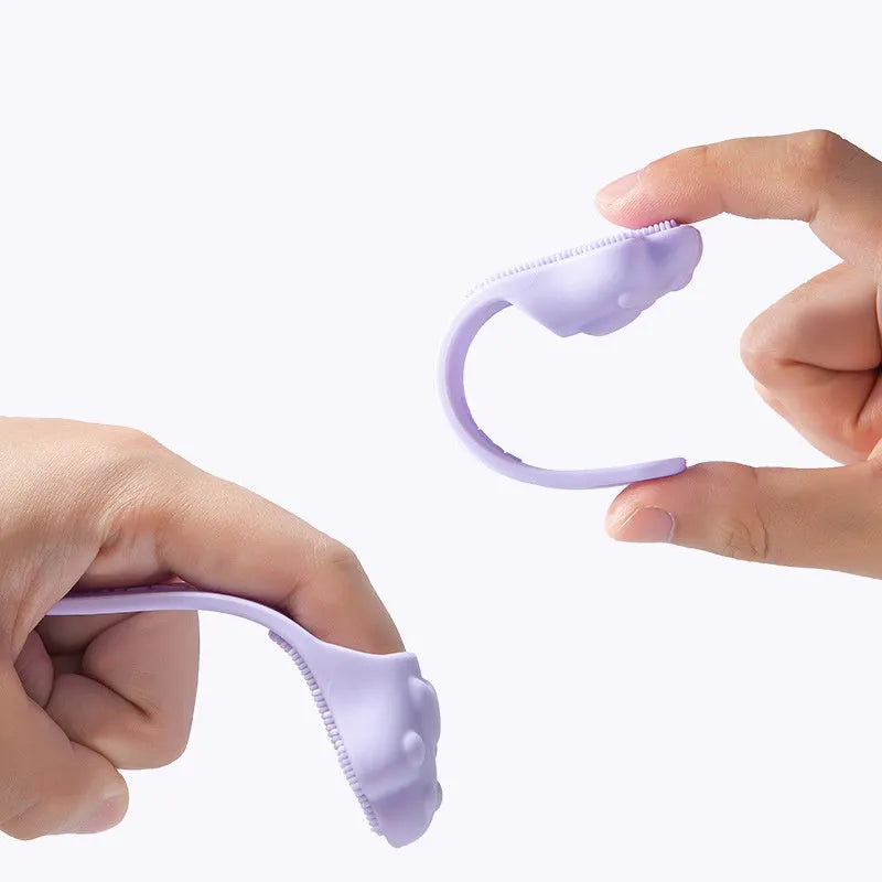 Silicone finger cover toothbrush for pet dental cleaning in pink, purple, and yellow colours.