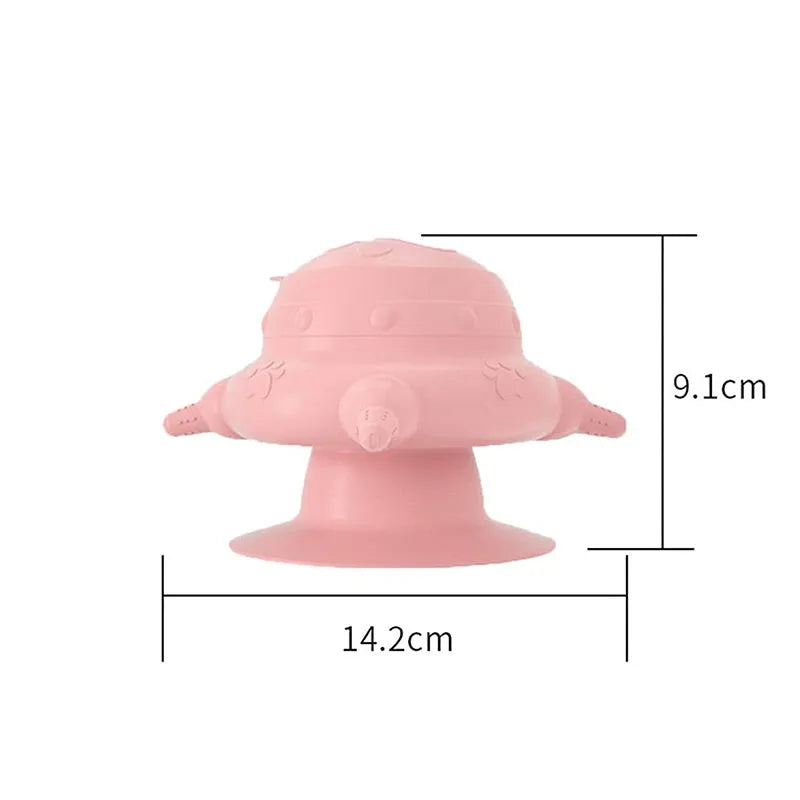 Pink silicone pet nursing device with bionic breast-shaped bowl and flat base for puppies and kittens.