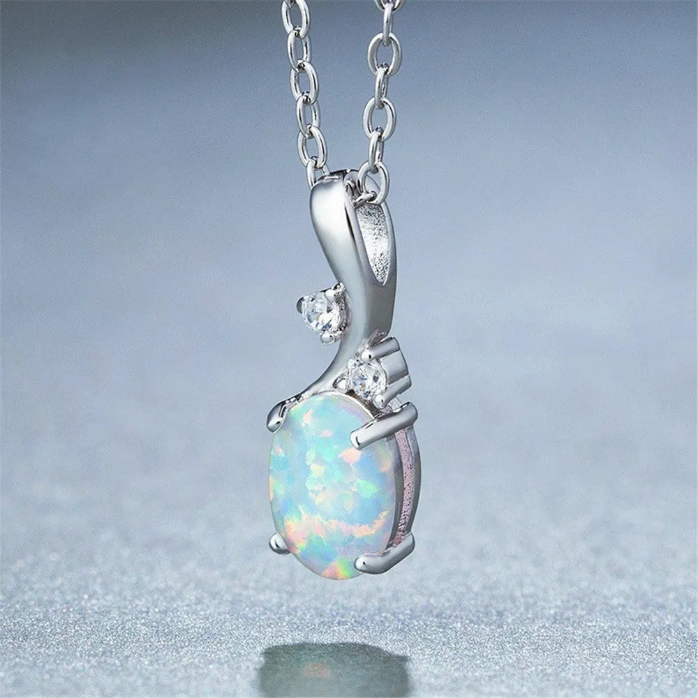 Water drop shaped opal pendant necklace on an adjustable chain in rose gold or white colour.