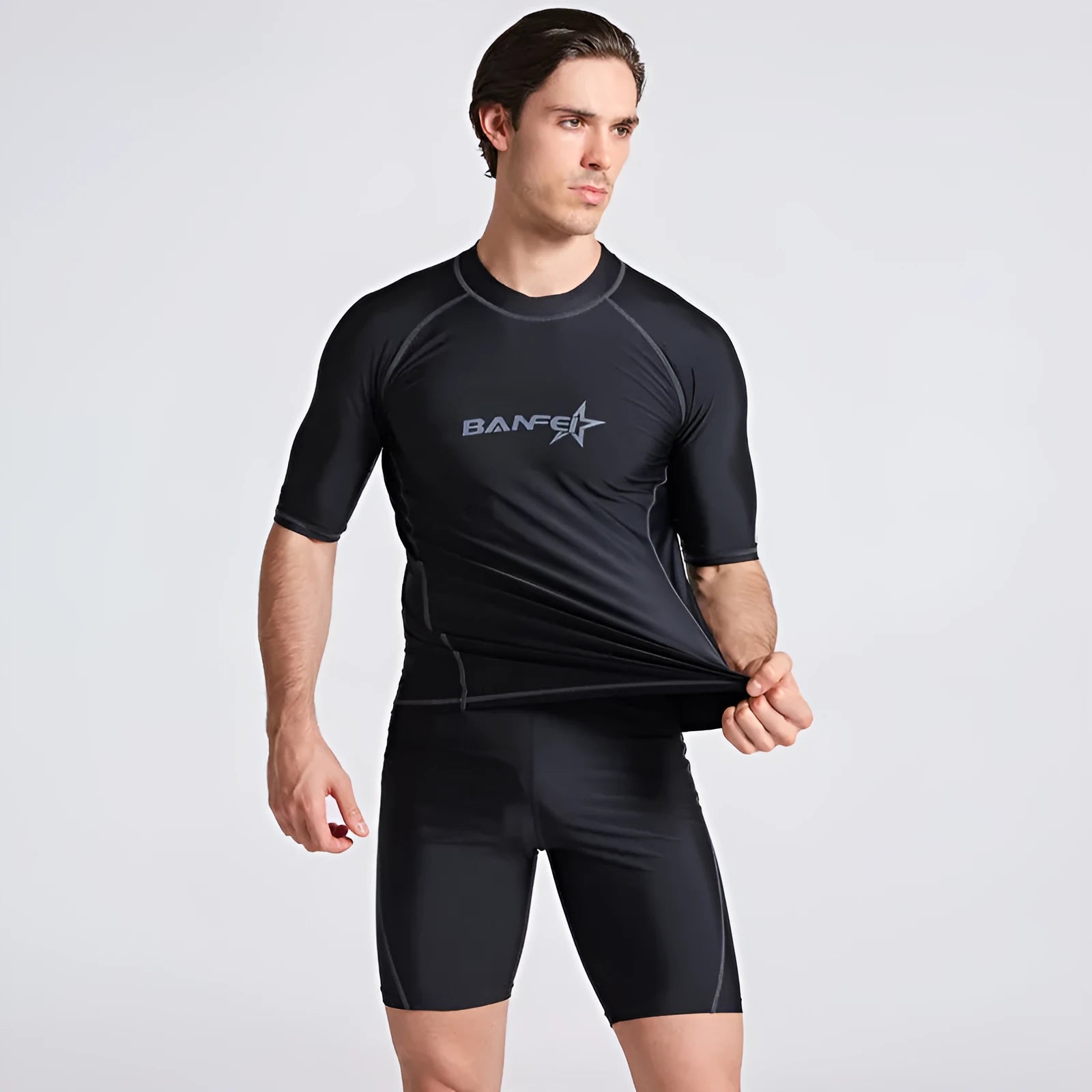 Men's blue half-sleeve quick-dry nylon swimsuit top and pants set for swimming and surfing.