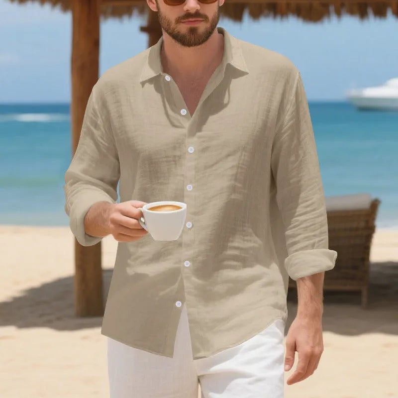 A man's loose-fit linen Hawaiian casual shirt in an earthy colour on a hanger.