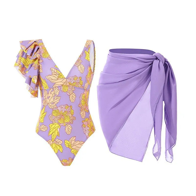 Women's solid colour spaghetti strap one-piece swimsuit with a matching skirt.