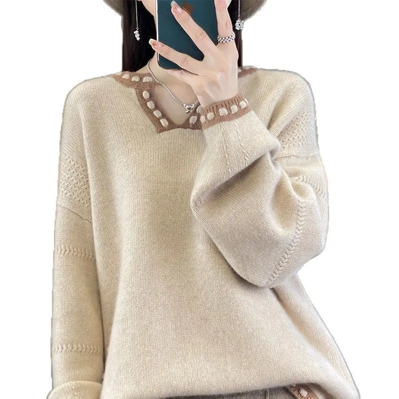 Women's camel coloured V-neck long sleeve viscose sweater on a hanger.