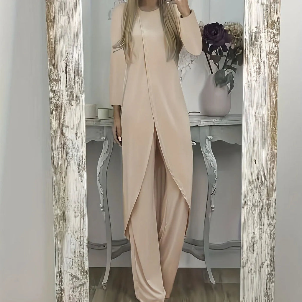 A loose-fitting black two-piece lounge set consisting of a long-sleeve round-neck top and matching trousers.